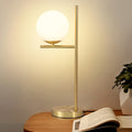 Goldene Tischlampe mit Glaskugel